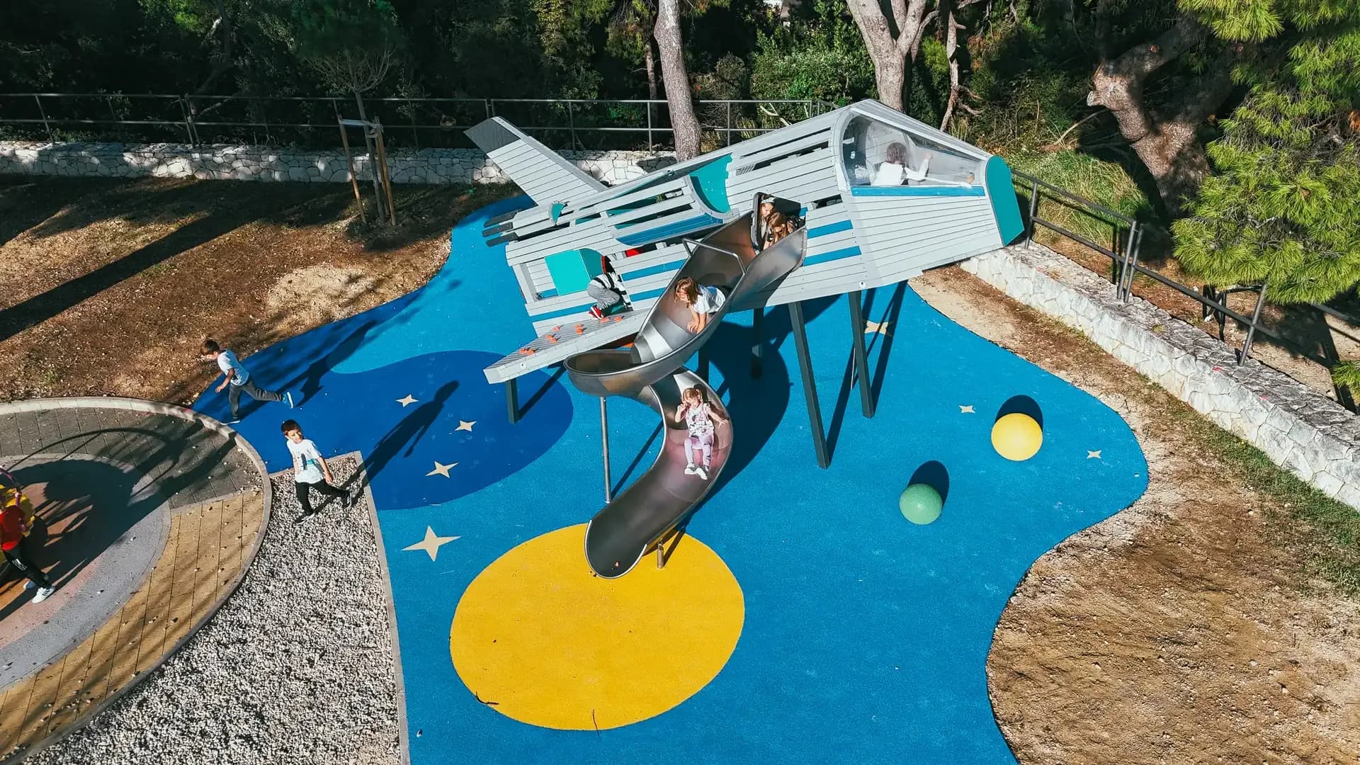 The full playground site at Makarska Observatory from above, with planets and stars on the surfacing.