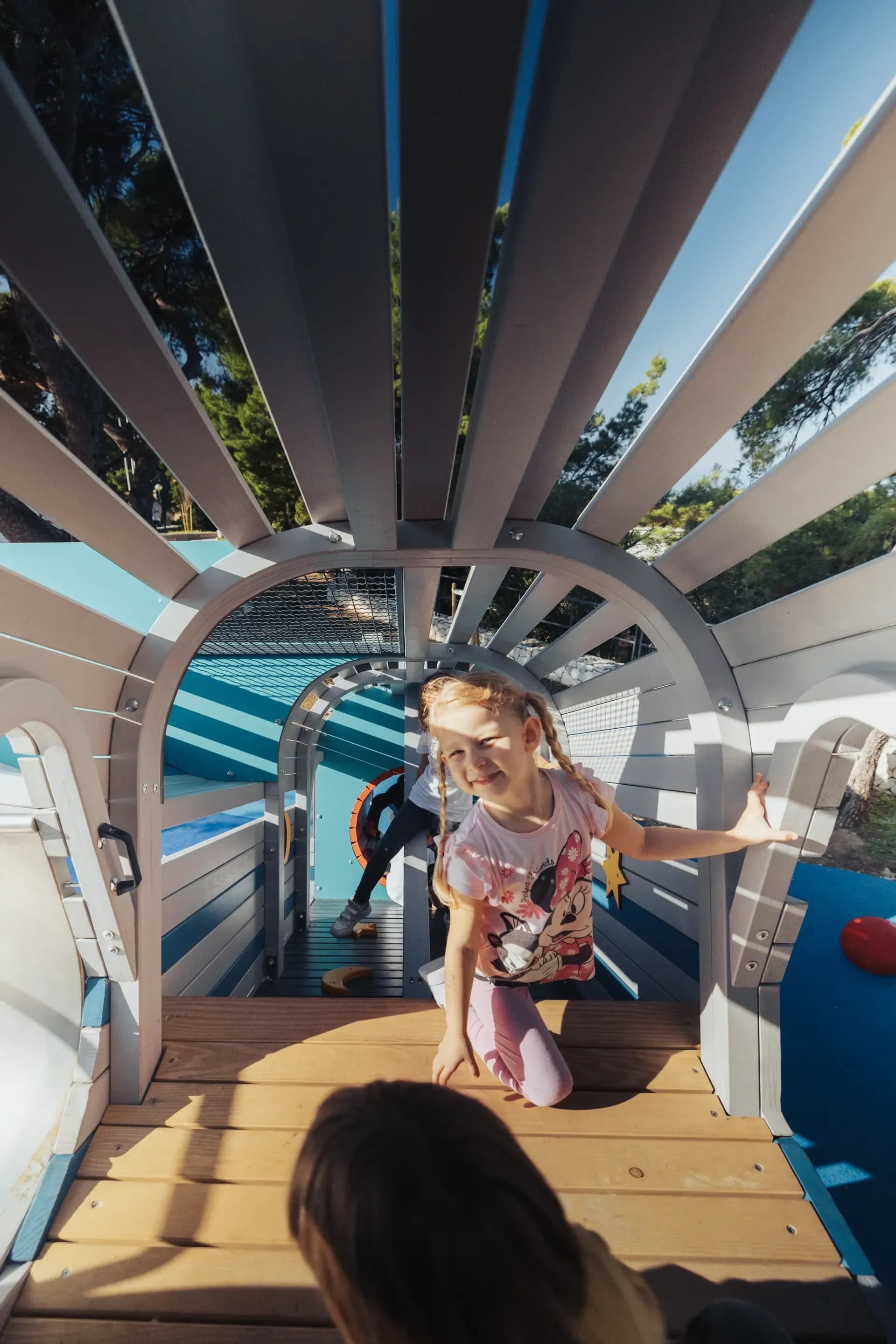 A hidden passage inside the rocket structure at Makarska Observatory, with a child crawling through.