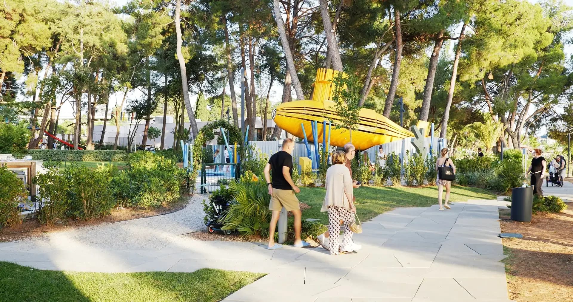 View from the promenade towards the submarine, resort guests passing by
