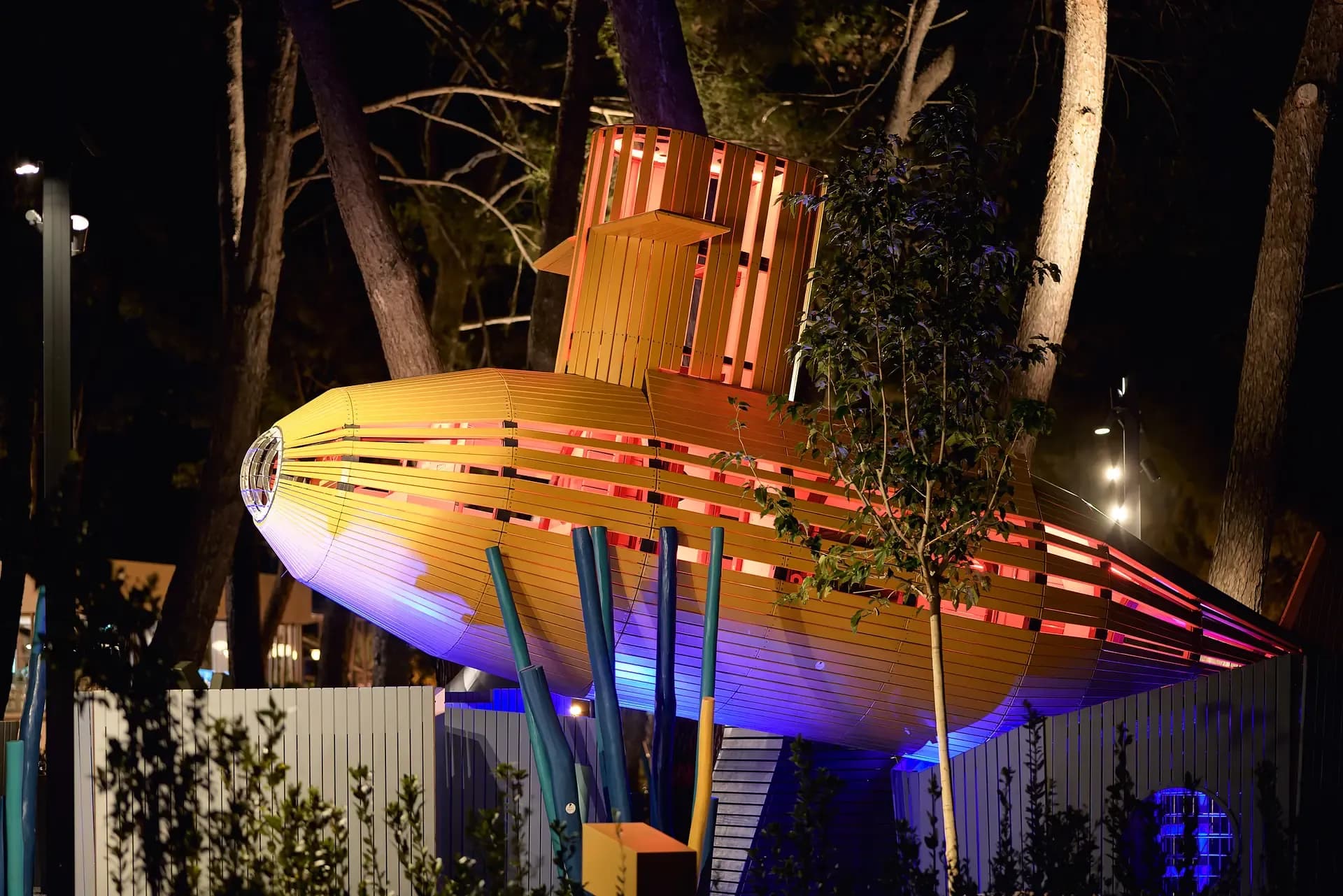 The submarine lit from within, after sunset