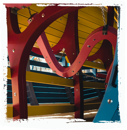 Detail of curved structural beams and a connecting walkway inside the play structure at Sea World.