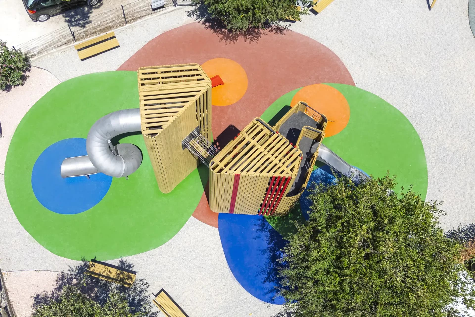 Aerial view of the Urban Structure playground in Trogir, showing the tube slide and red slide exits.