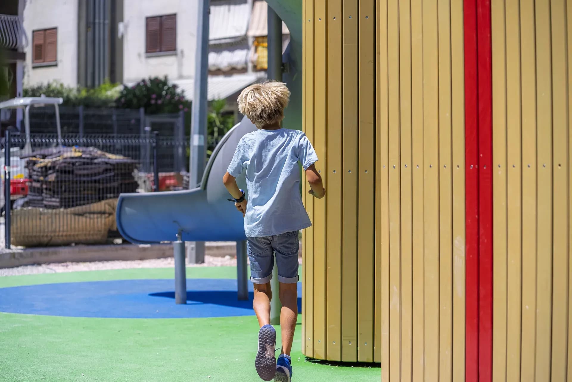 A child moving toward the Urban Structure playground in Trogir, discovering it through movement.