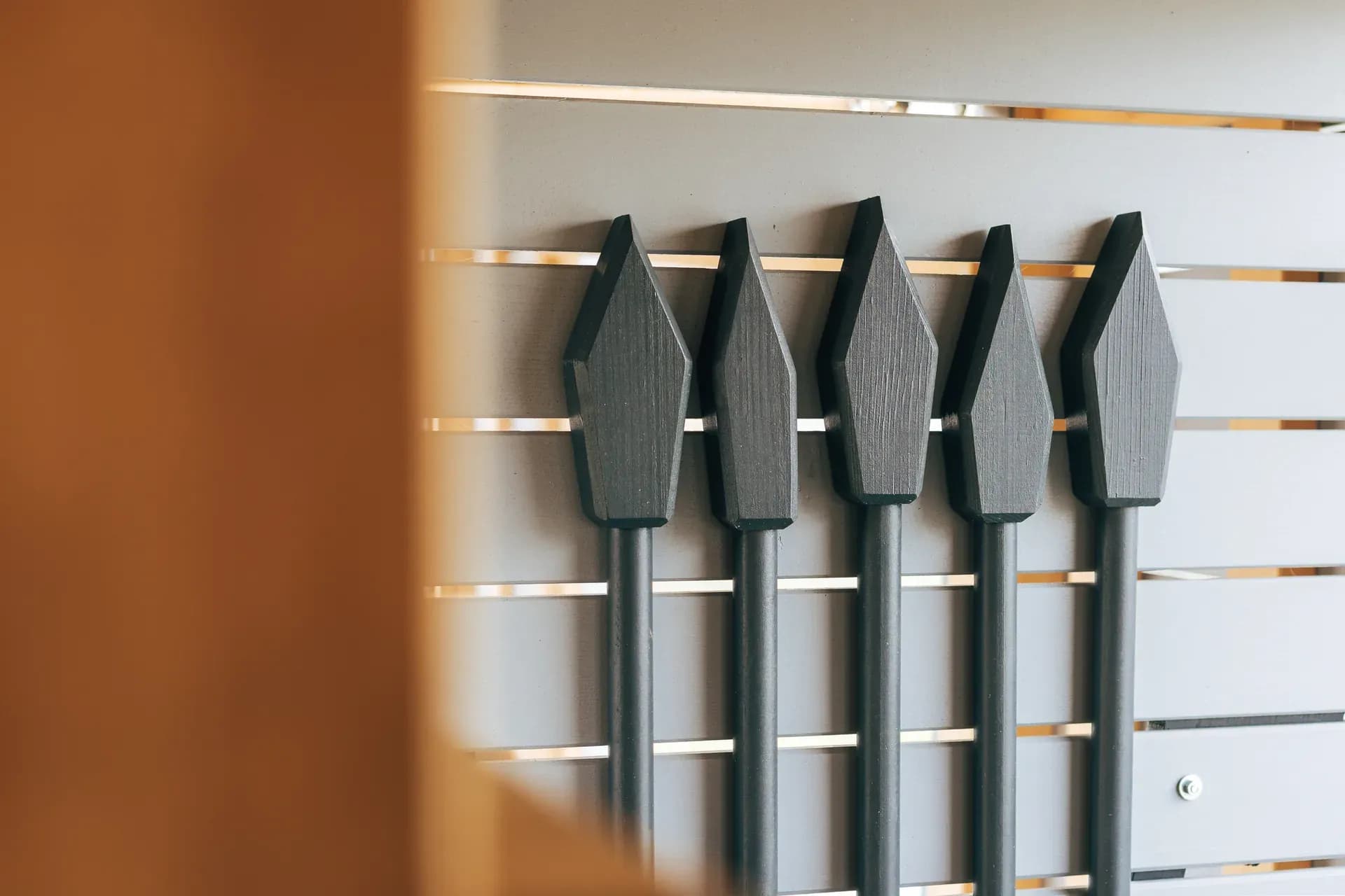 A row of spear-shaped grips along the wall of the Timeless Legends tower.