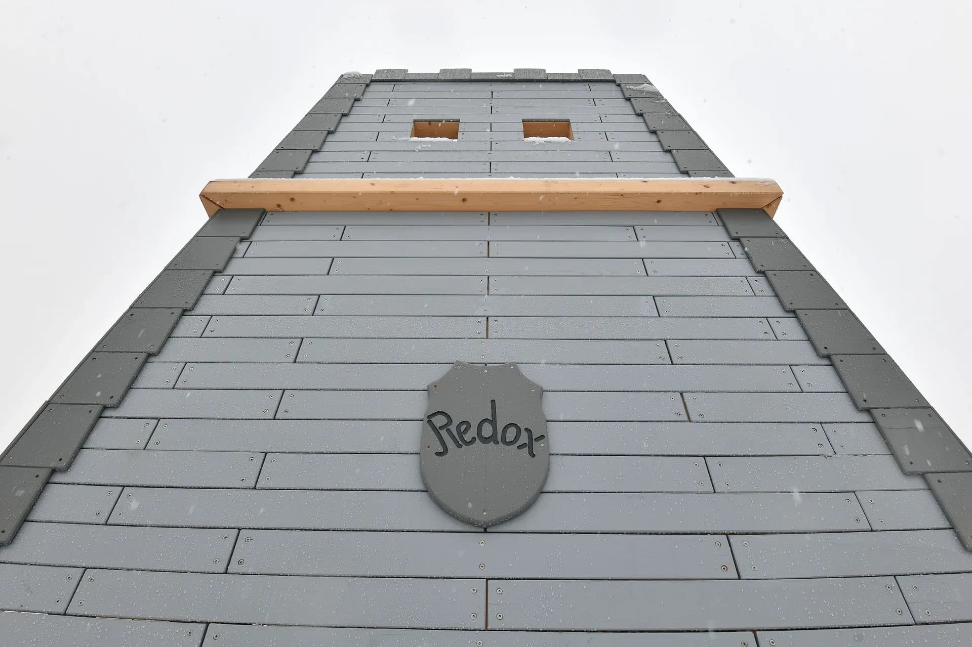 The Timeless Legends tower seen from below, in winter.